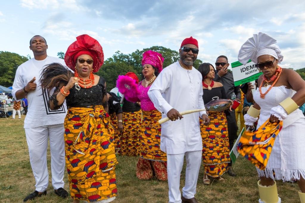 Mrs Ngozi Onubogu - Iyom Ugodiya Ekwekesili, President Nzuko Anambra Massachusetts, Ichie Jonas Okoye' Ochendo' Mrs Neca Mutawakil - Omenanwata doing their thing at the 2022 Igbo day Celebrations.